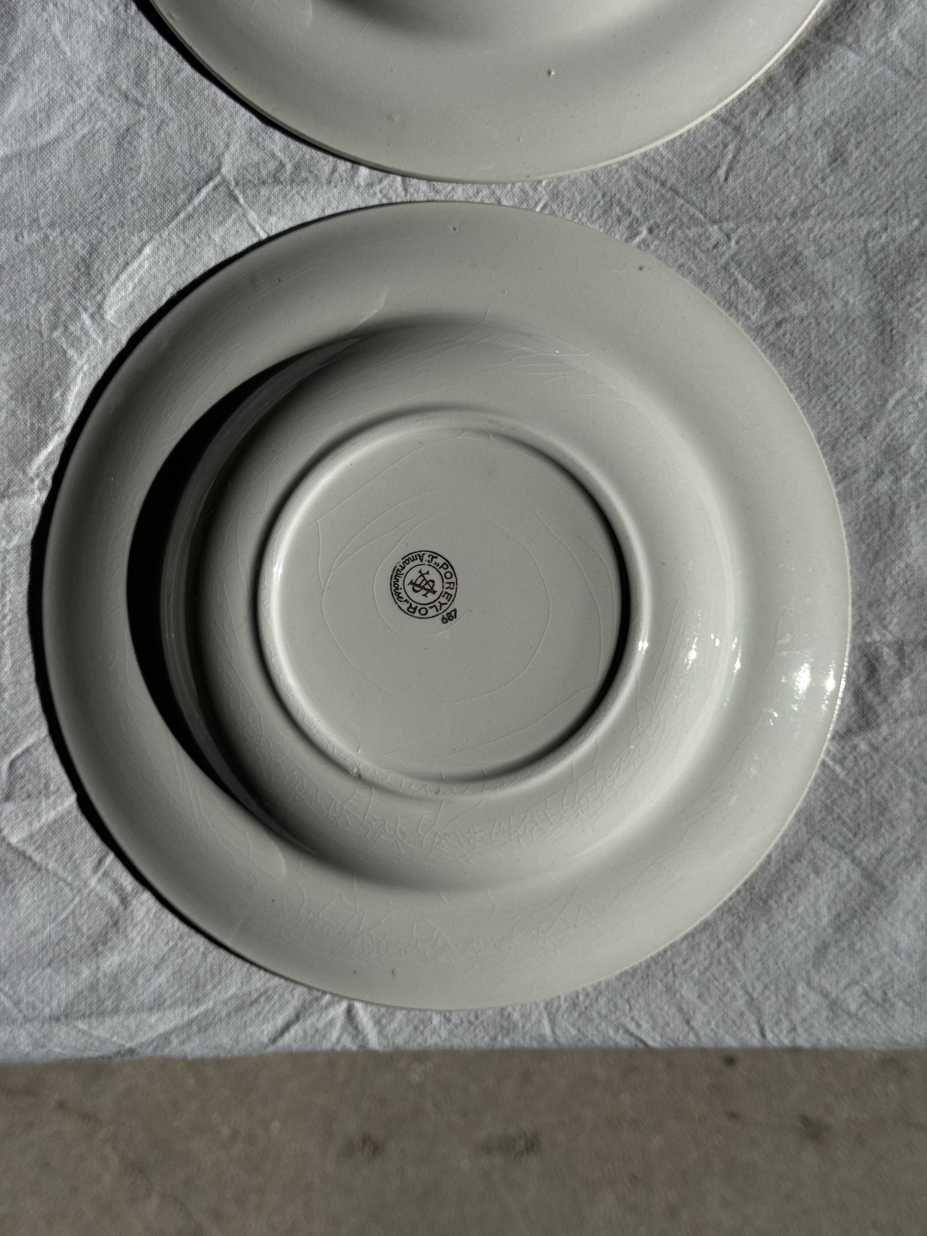 Set of 9 vintage turquoise deep plates with gold trim and pink flowers.