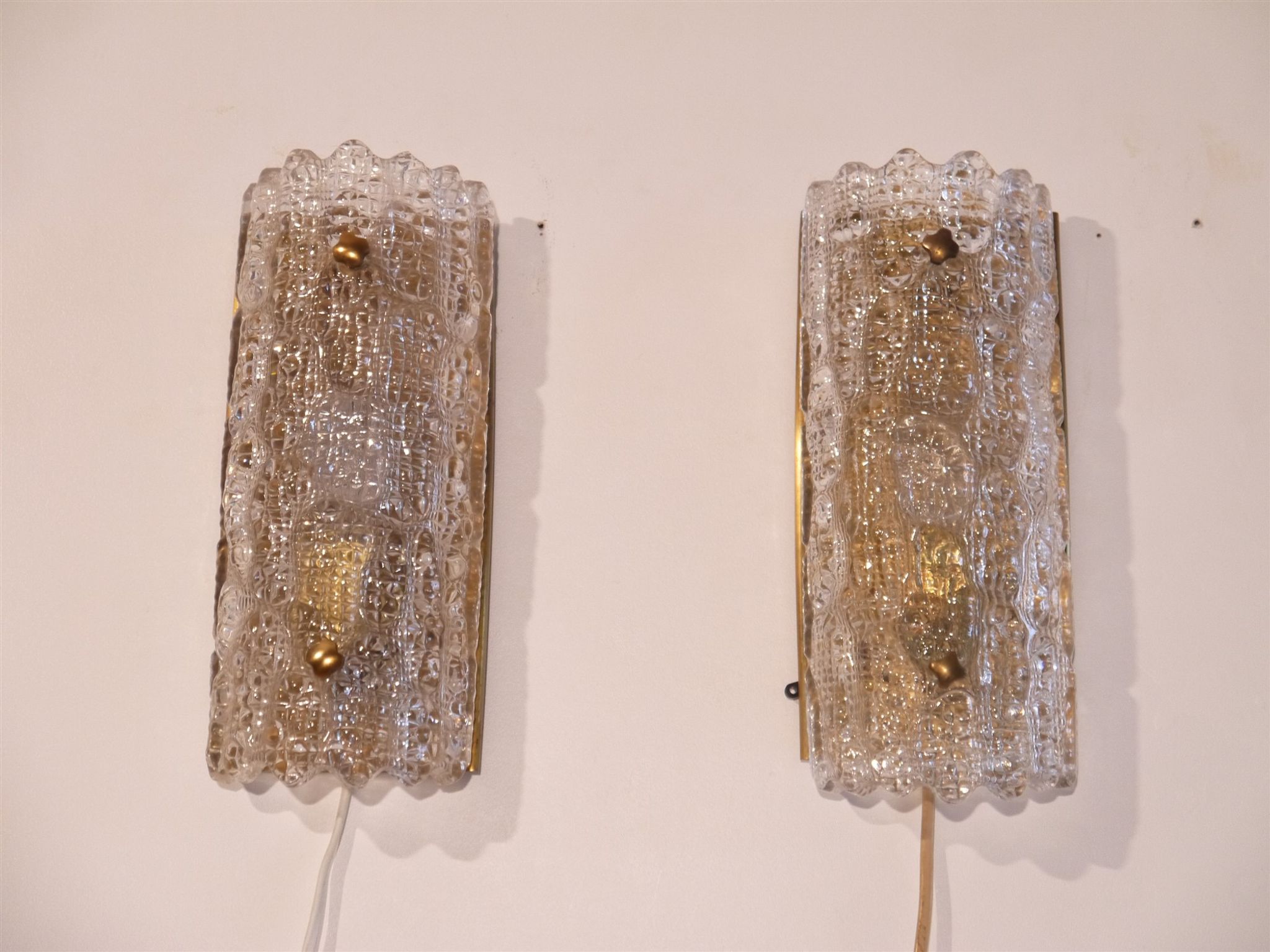 Pair of brass and crystal appliques by Carl Fagerlund for Orrefors