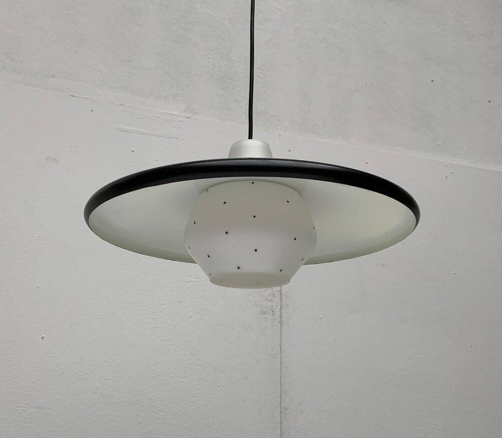 Minimalist metal and glass pendant lamp in mid-century style.