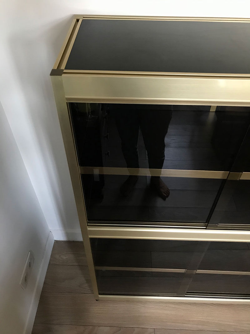 Shelves of black and gold windows