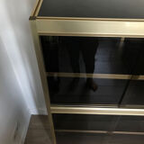 Shelves of black and gold windows