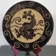 Dauphinois plate in glazed terracotta from around 1950 with dolphin decoration.