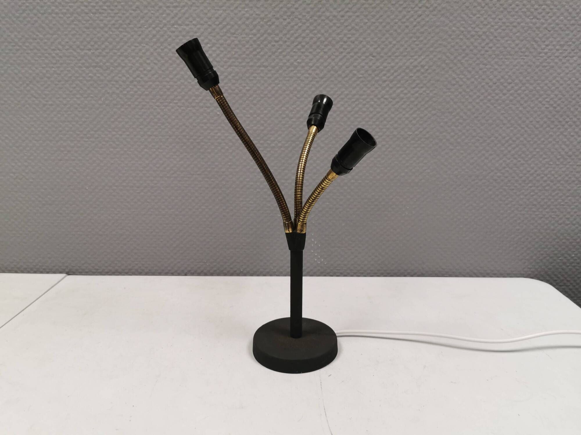 Old cast iron table lamp with brass bend and 3 light sources