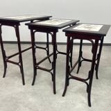 Nested tables in curved wood with ceramic top by Thonet.