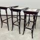 Nested tables in curved wood with ceramic top by Thonet.