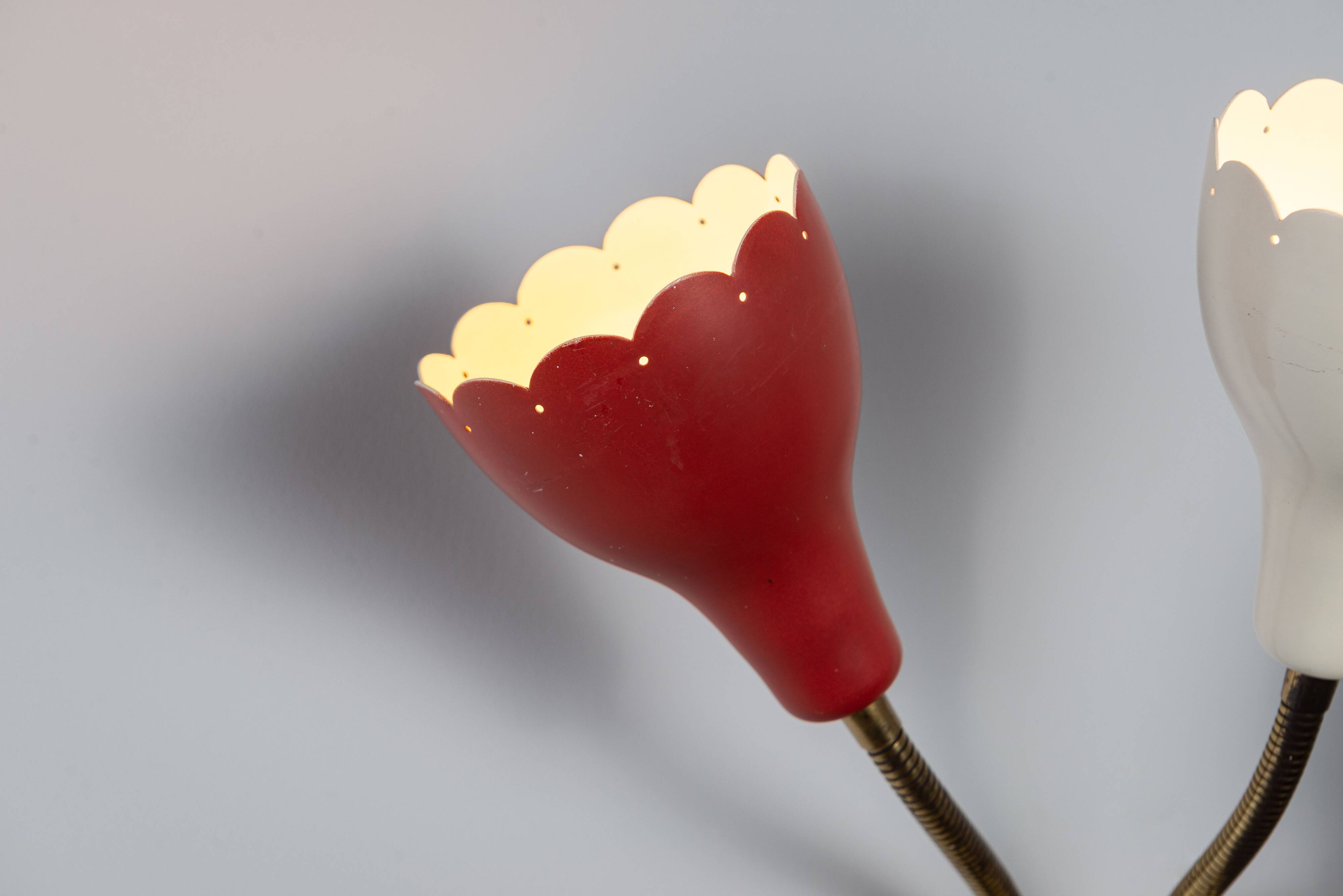 Adjustable wall lamp with three decorated shades in different colours