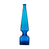 large blue glass obelisk-shaped bottle or vase