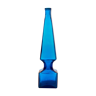 large blue glass obelisk-shaped bottle or vase