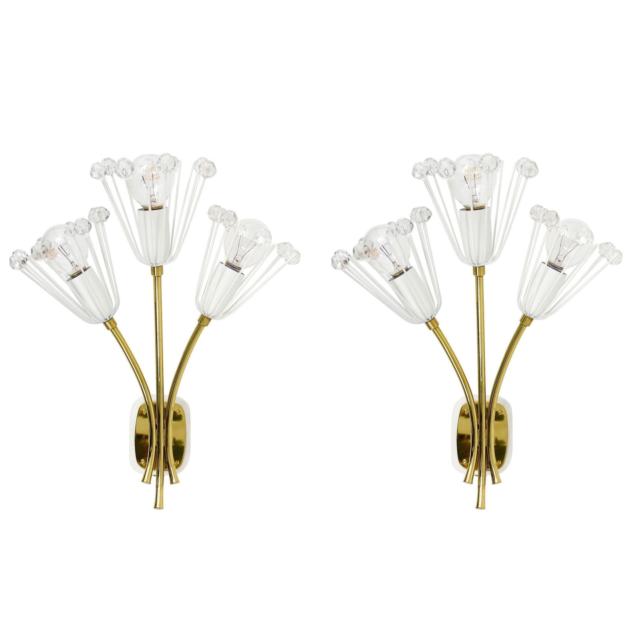 Pair of mid-century wall sconces in brass with flowers, Emil Stejnar, Rupert Nikoll, Austria, 1950s.
