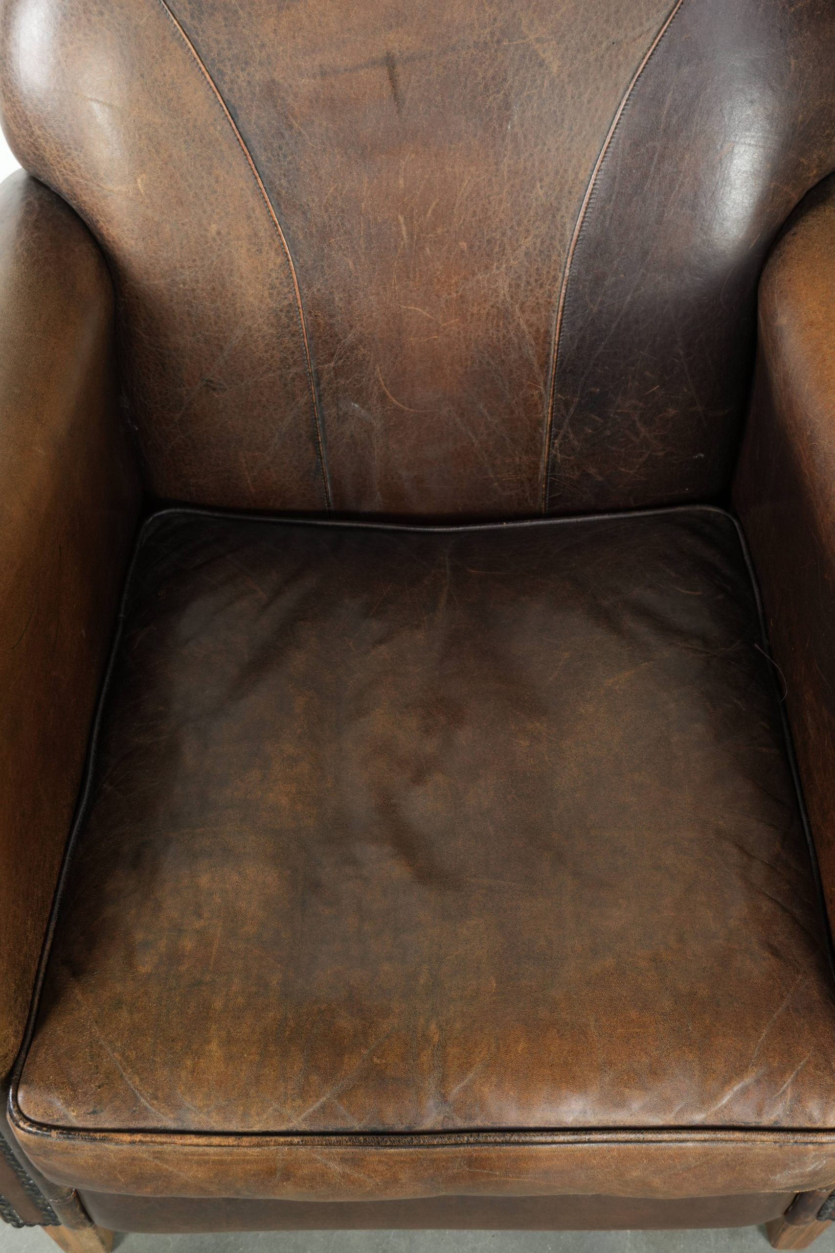Armchair / lounge chair made of sheepskin leather with characterful patina