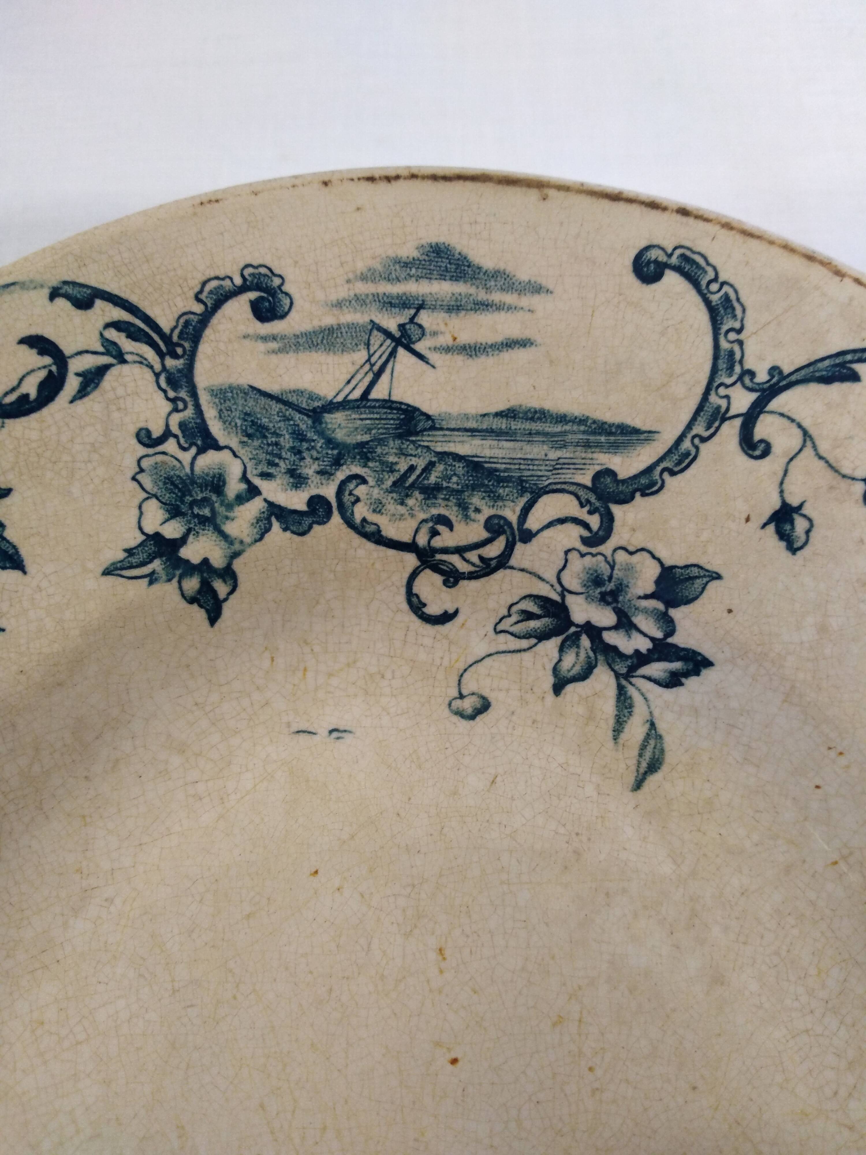 Old serving dish floral and maritime decoration