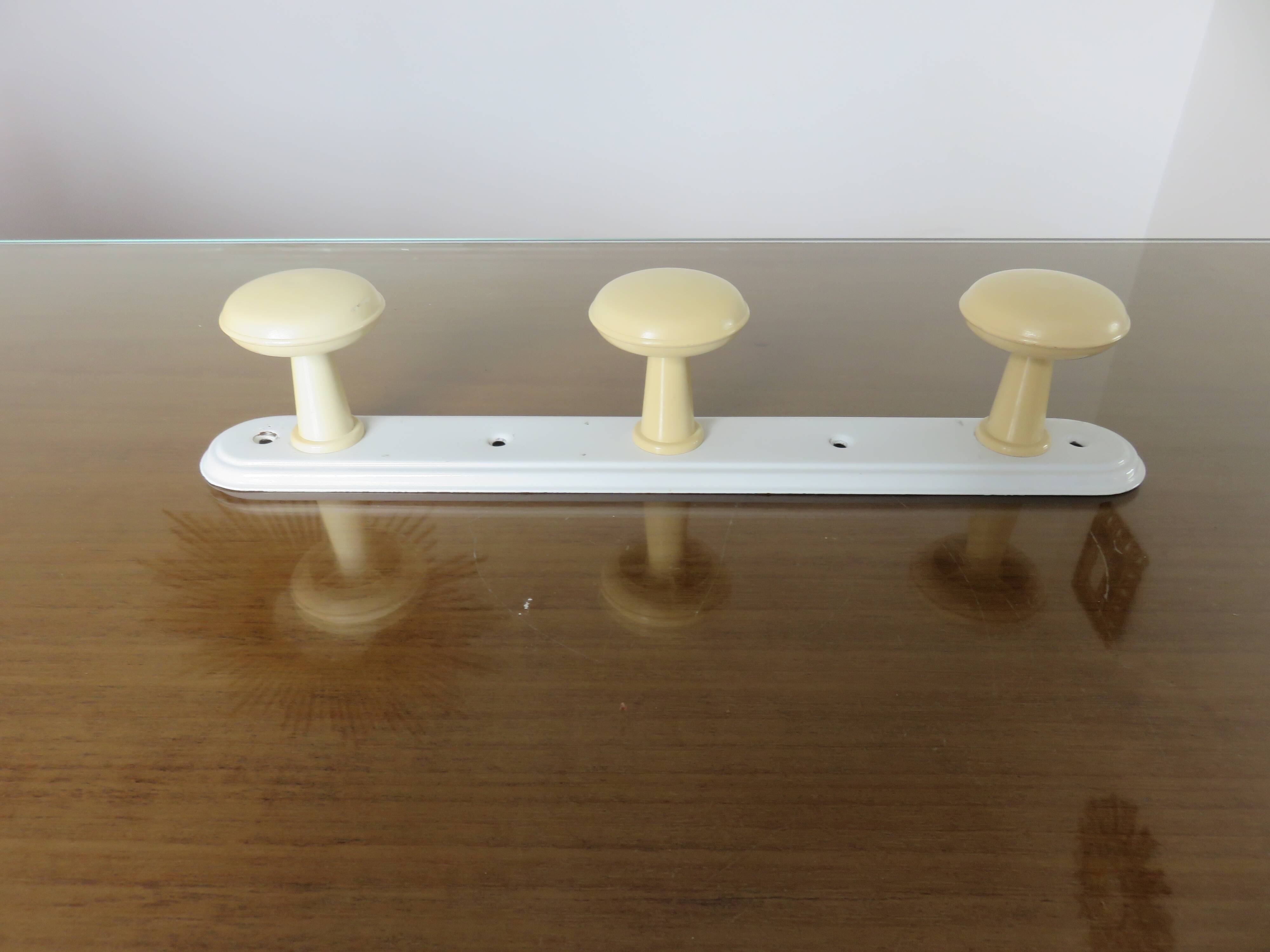 Wall coat rack with 3 coat hooks in bakelite from the 50s and 60s