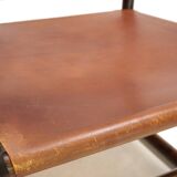 Manou rattan armchair with leather seat, 1960
