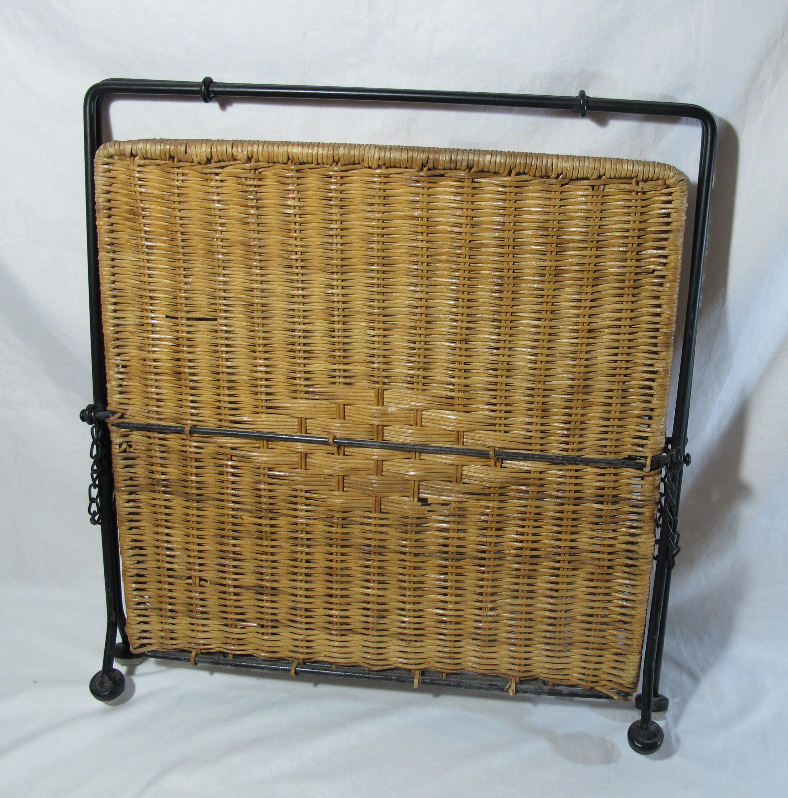 Vintage magazine rack in metal and wicker