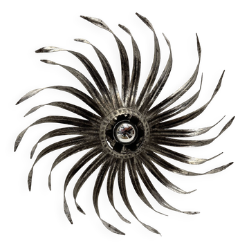 Silver wrought iron sunburst wall light from the 1960s.