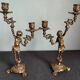 Pair of antique candlesticks in cherub bronze
