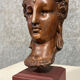 Diane de Poitiers stone bust on a terrace in false pretense of marble