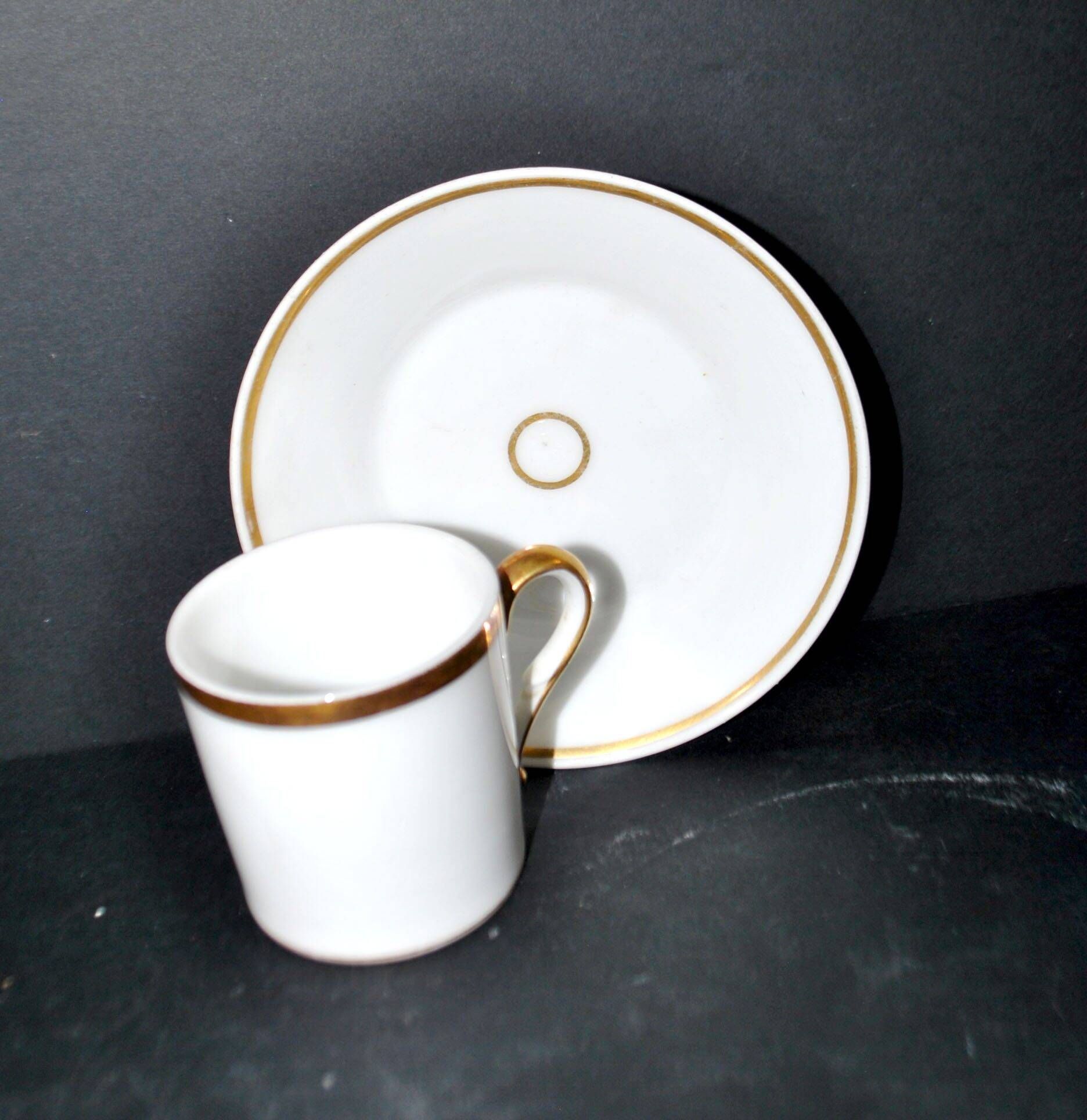Charles Hebert Rouen porcelain – Antique litron coffee cup with gold trim.
