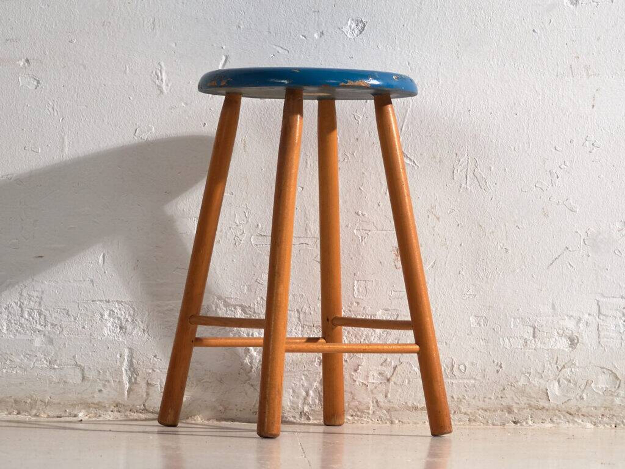 Antique wooden stool with a round seat – Central Europe, around 1950