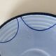 A pair of glazed ceramic cups and saucers from the 60s-70s.