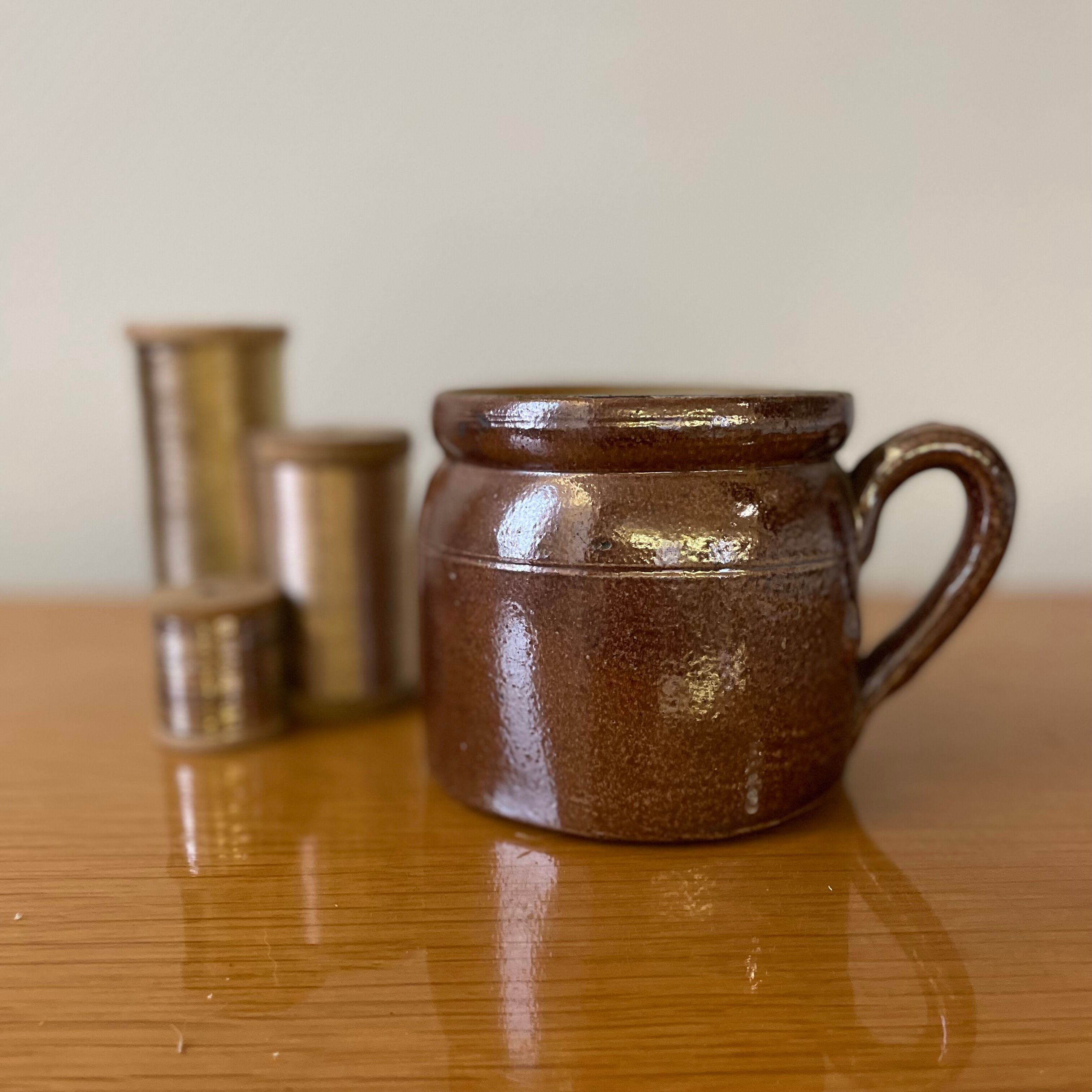 Stoneware pot with glossy glazed brown and vintage speckled gray handle