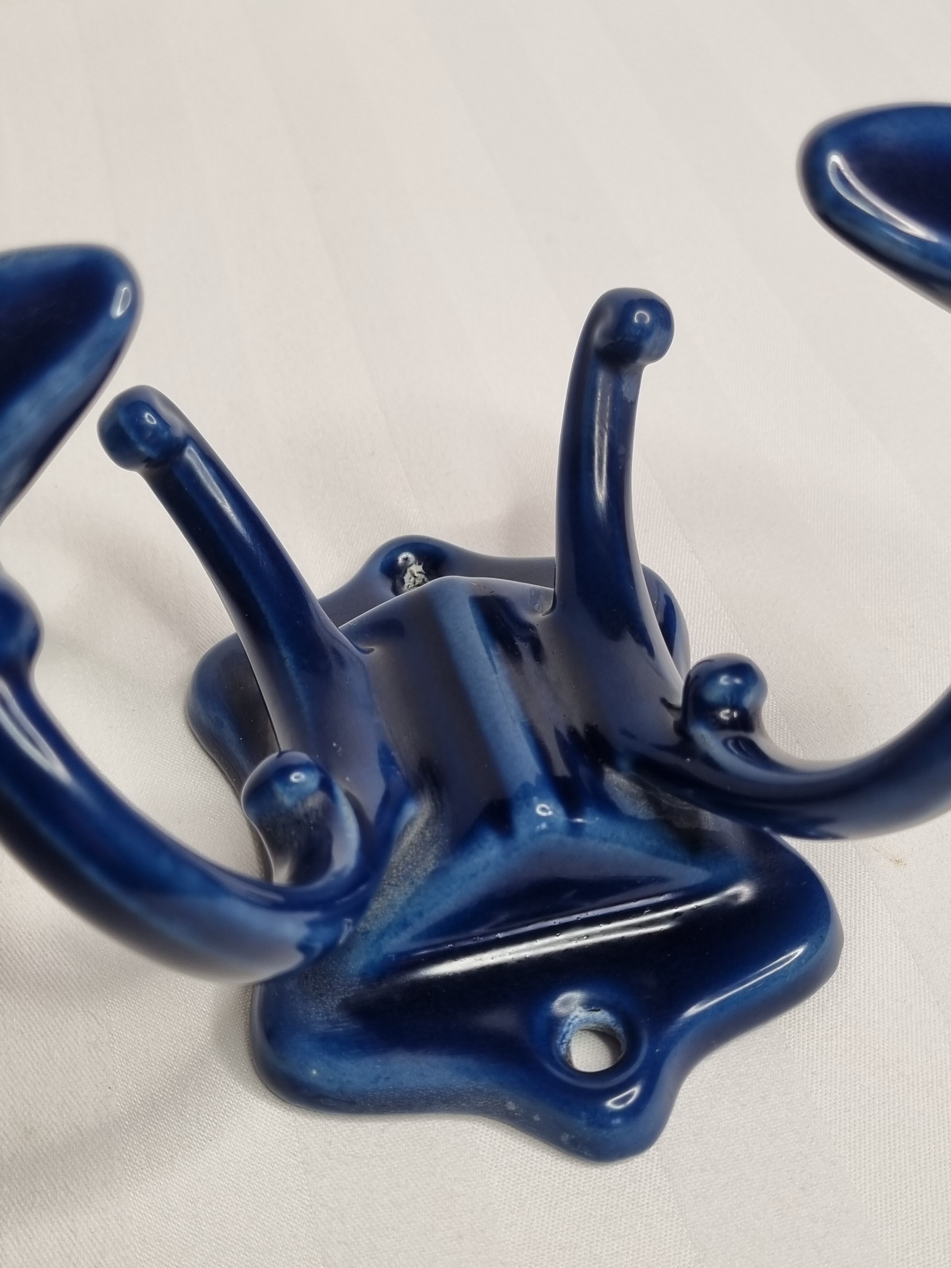 Pair of 1910 art nouveau period coat hooks in blue enameled cast iron