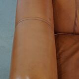 Cognac-colored cowhide leather armchair