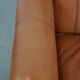 Fauteuil en cuir de vachette couleur cognac