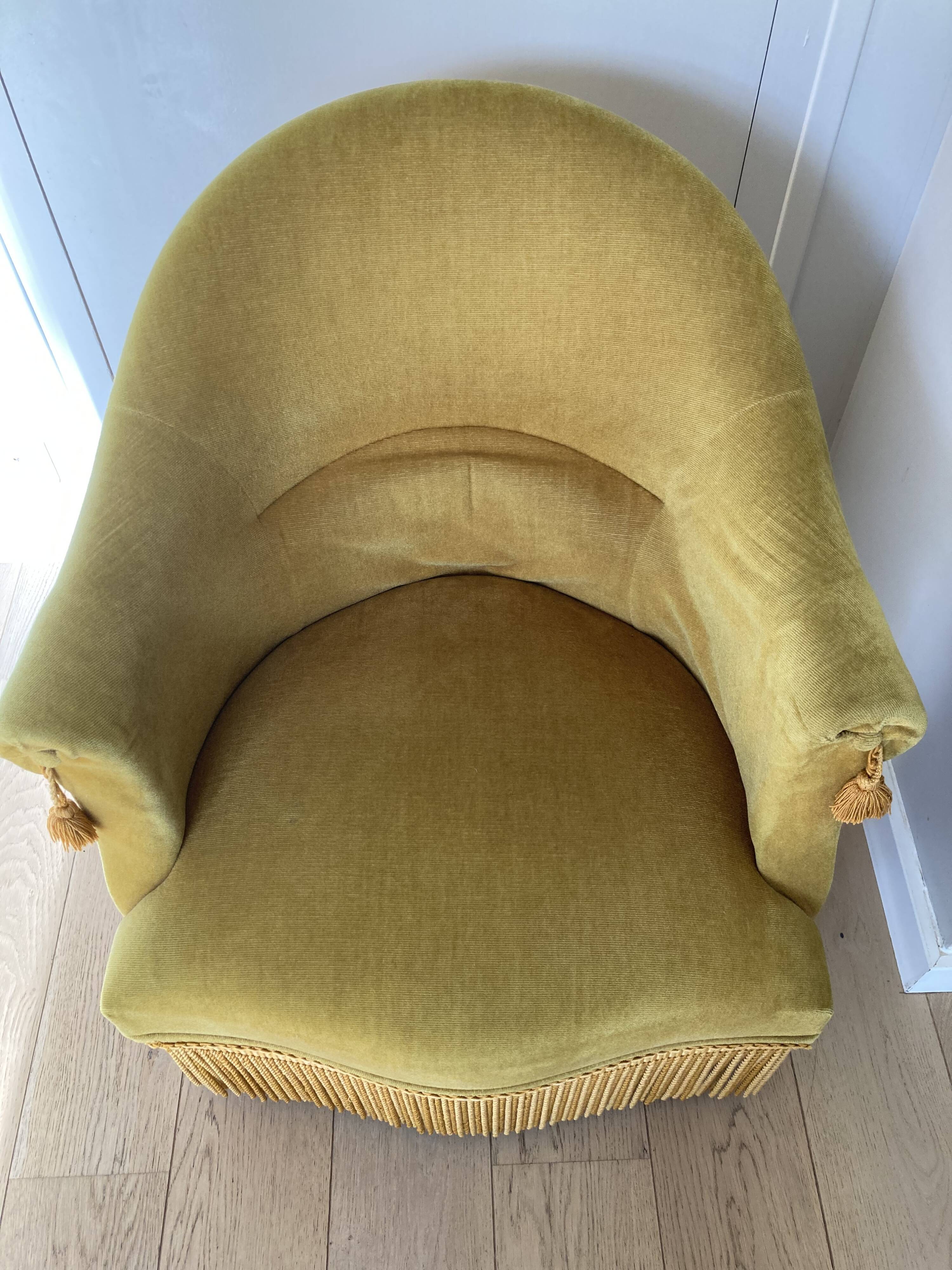 Velvet armchair with fringes