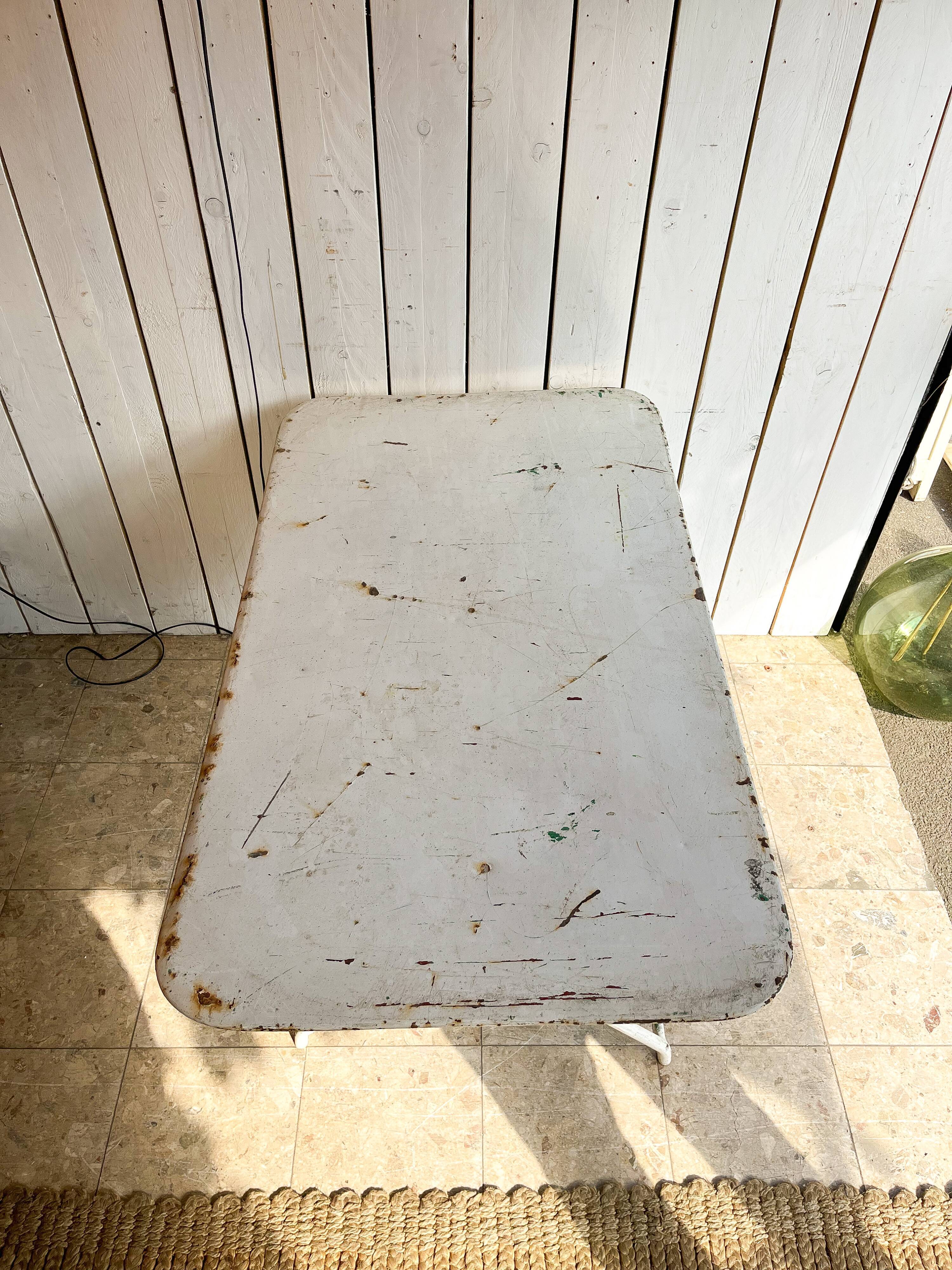 White folding metal bistro table