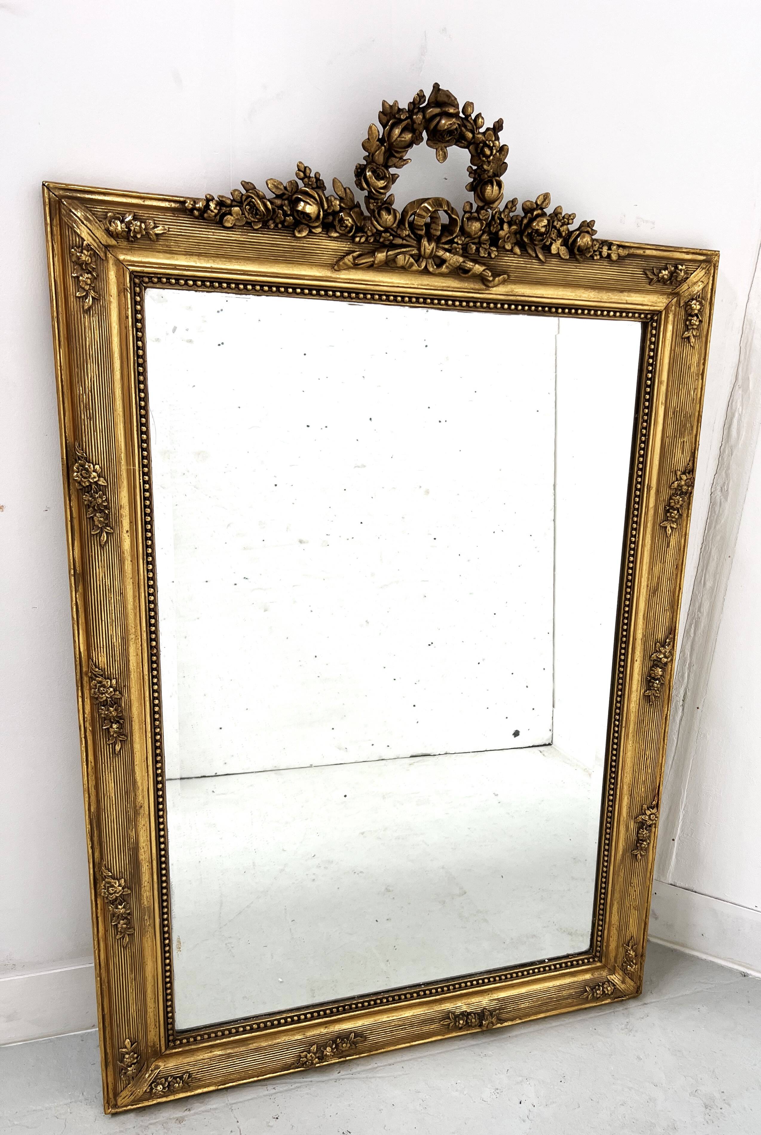 Louis XVI style mirror in wood and gilded stucco, 19th century