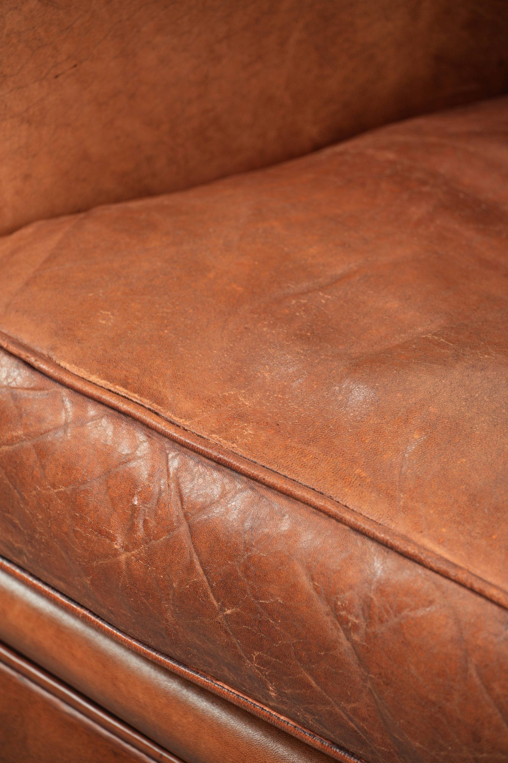 Sheepskin armchair with comfortable seat and finished with decorative nails