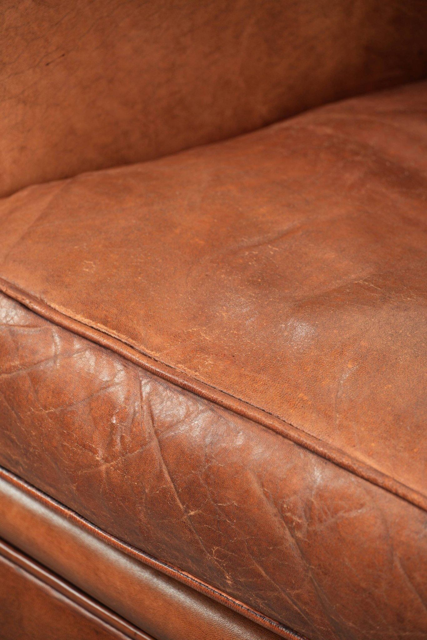 Sheepskin armchair with comfortable seat and finished with decorative nails