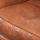 Sheepskin armchair with comfortable seat and finished with decorative nails