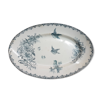 Plat en faïence à décor de fleurs et oiseau