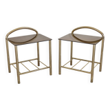 Pair of bedside tables with gold metal and mirrored glass top.