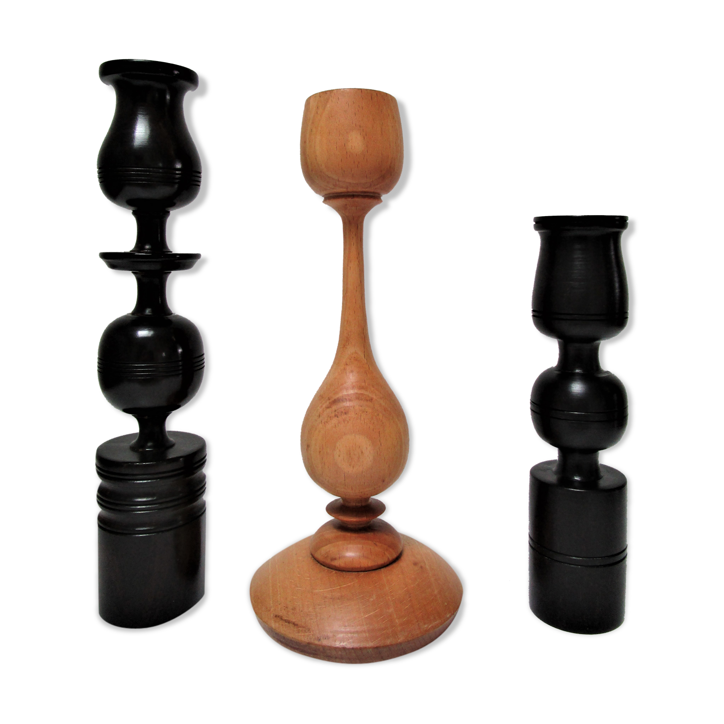 Three vintage light and dark wood candlesticks