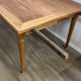 Dining table with tapered legs and solid exotic wood