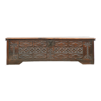 Antique chest in carved wood