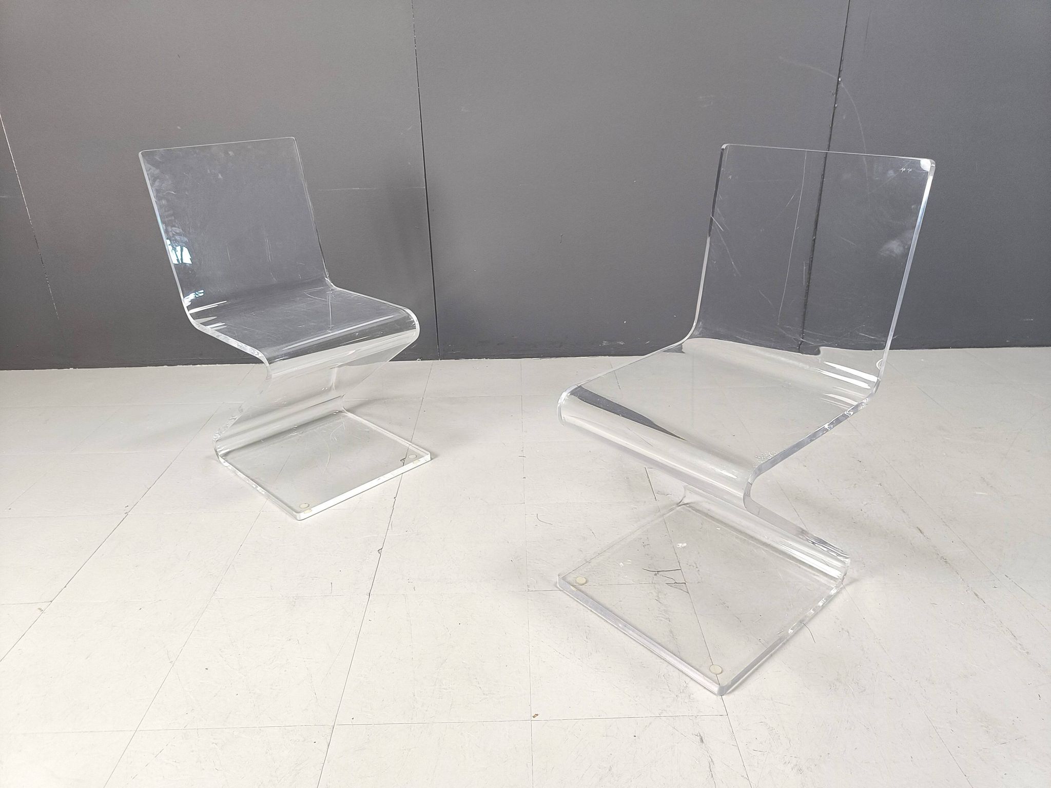 Pair of lucite zigzag dining chairs, 1980s