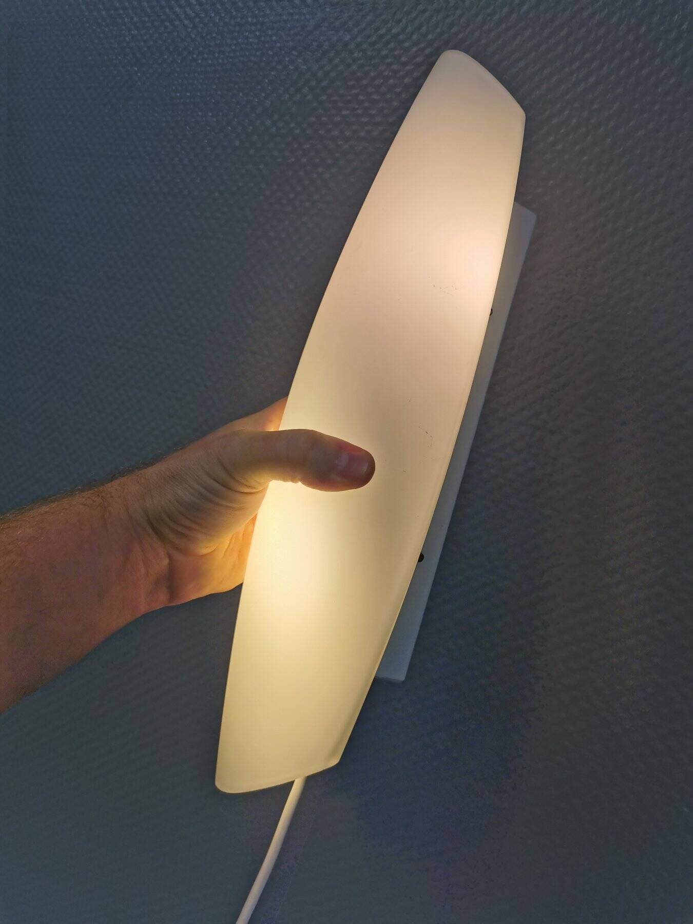 Wall lamp from Paulmann with white opal glass shade.