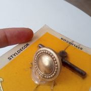 Vintage furniture knob in Louis XVI style, gilded with fine gold.