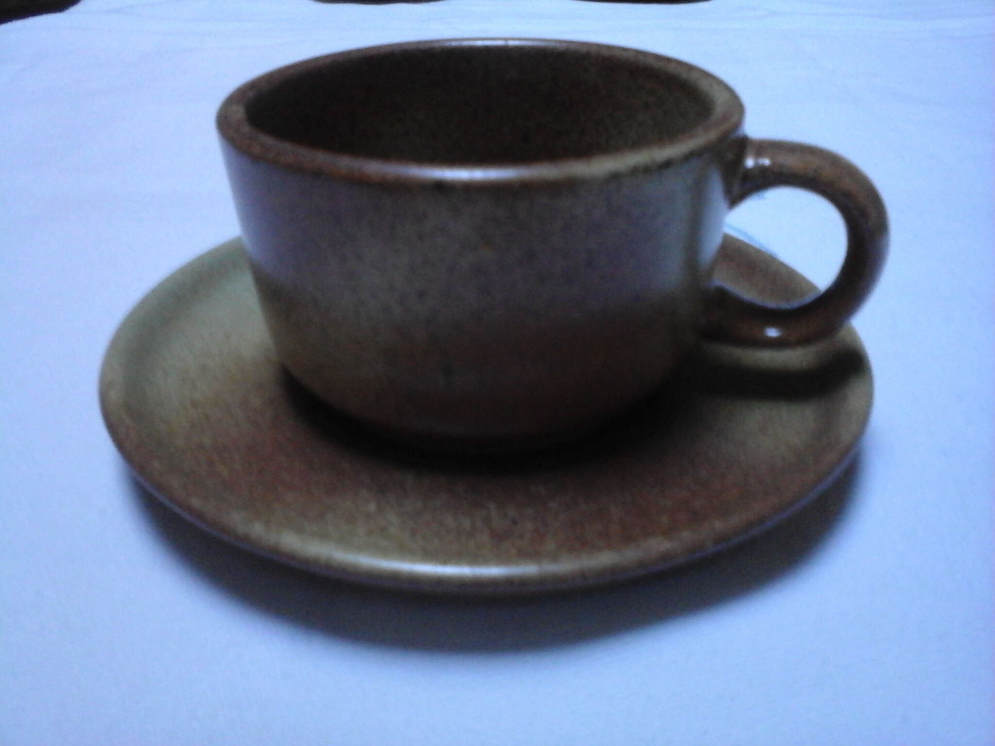 5 Cups with sandstone saucers
