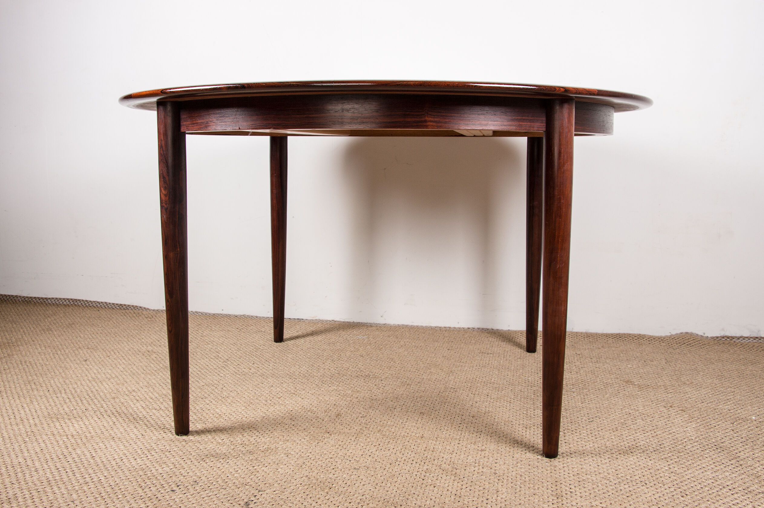 Danish extendable dining table in Rio Rosewood model 55 by Arne Vodder for Sibast 1958.