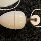Suspension rises and falls with counterweight in porcelain and opaline