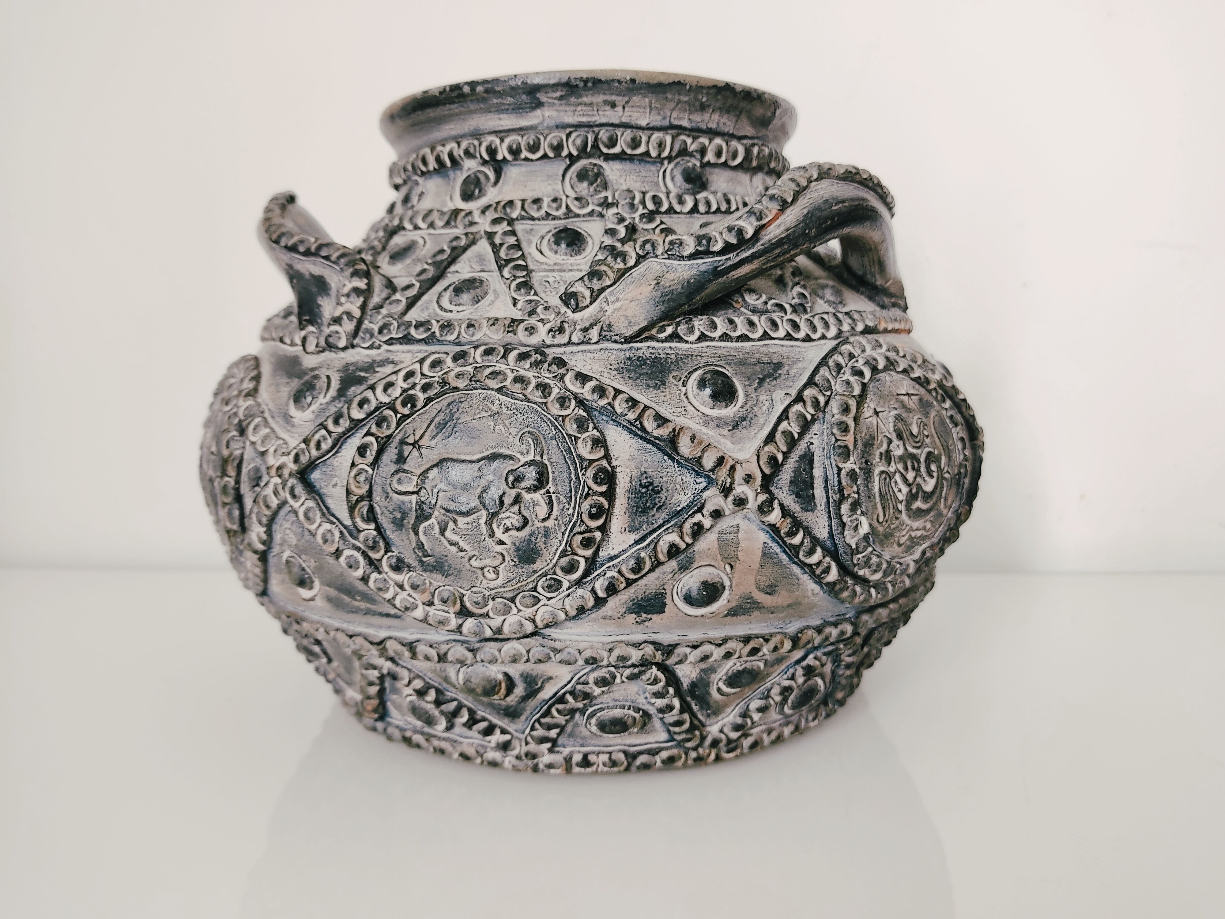 Terracotta vase with decoration astrological signs