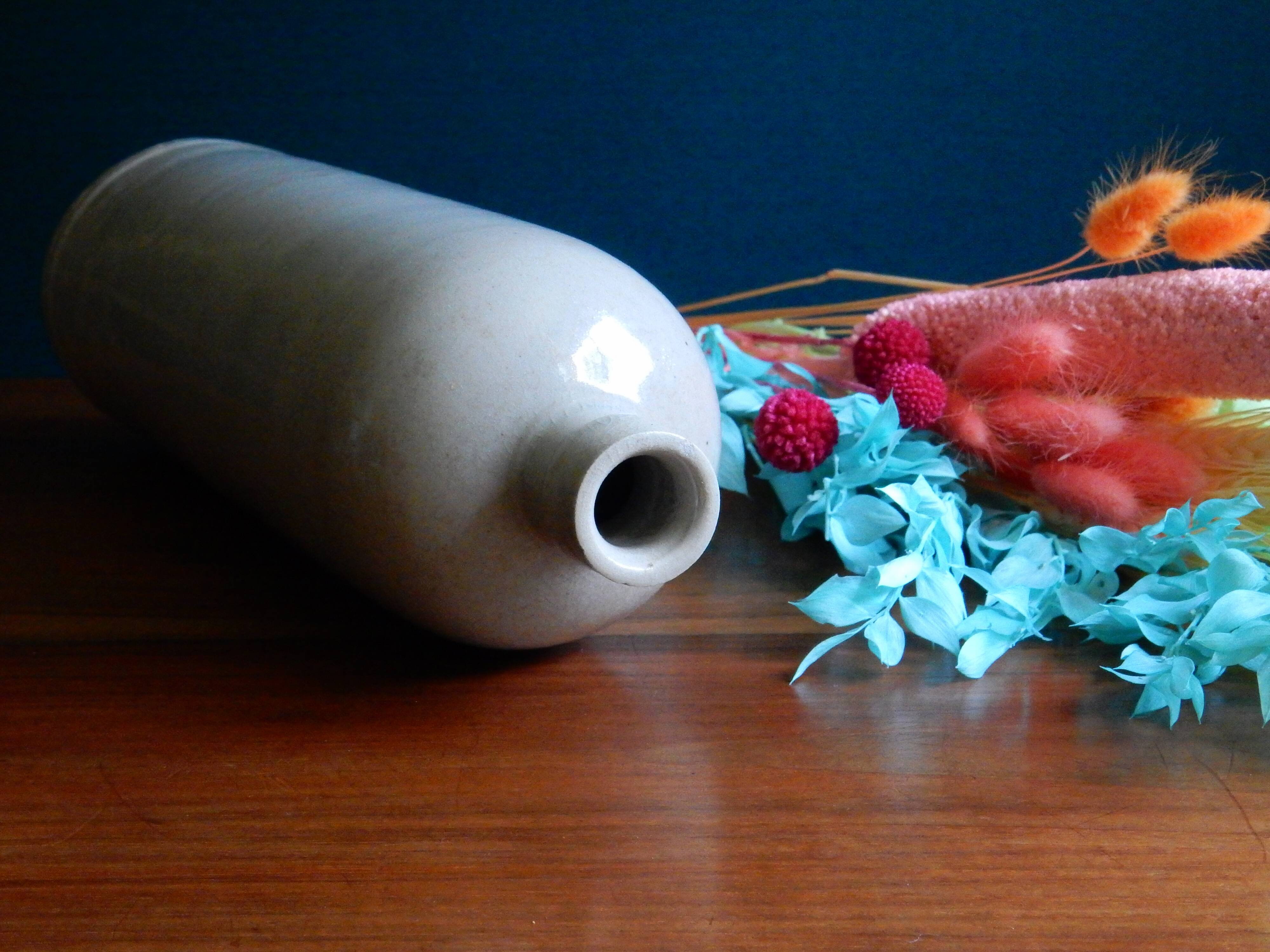 Enamelled white stoneware bottle