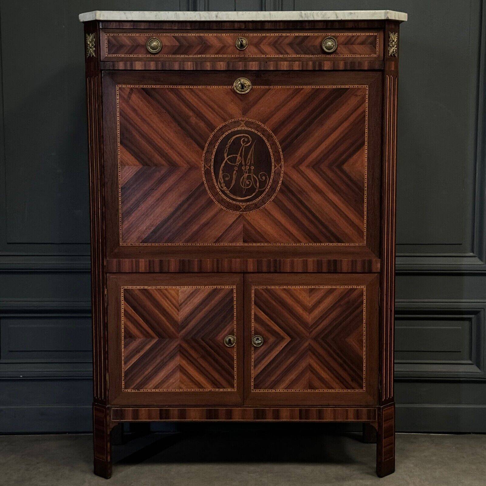 Louis XVI period secretary in monogram marquetry and white marble