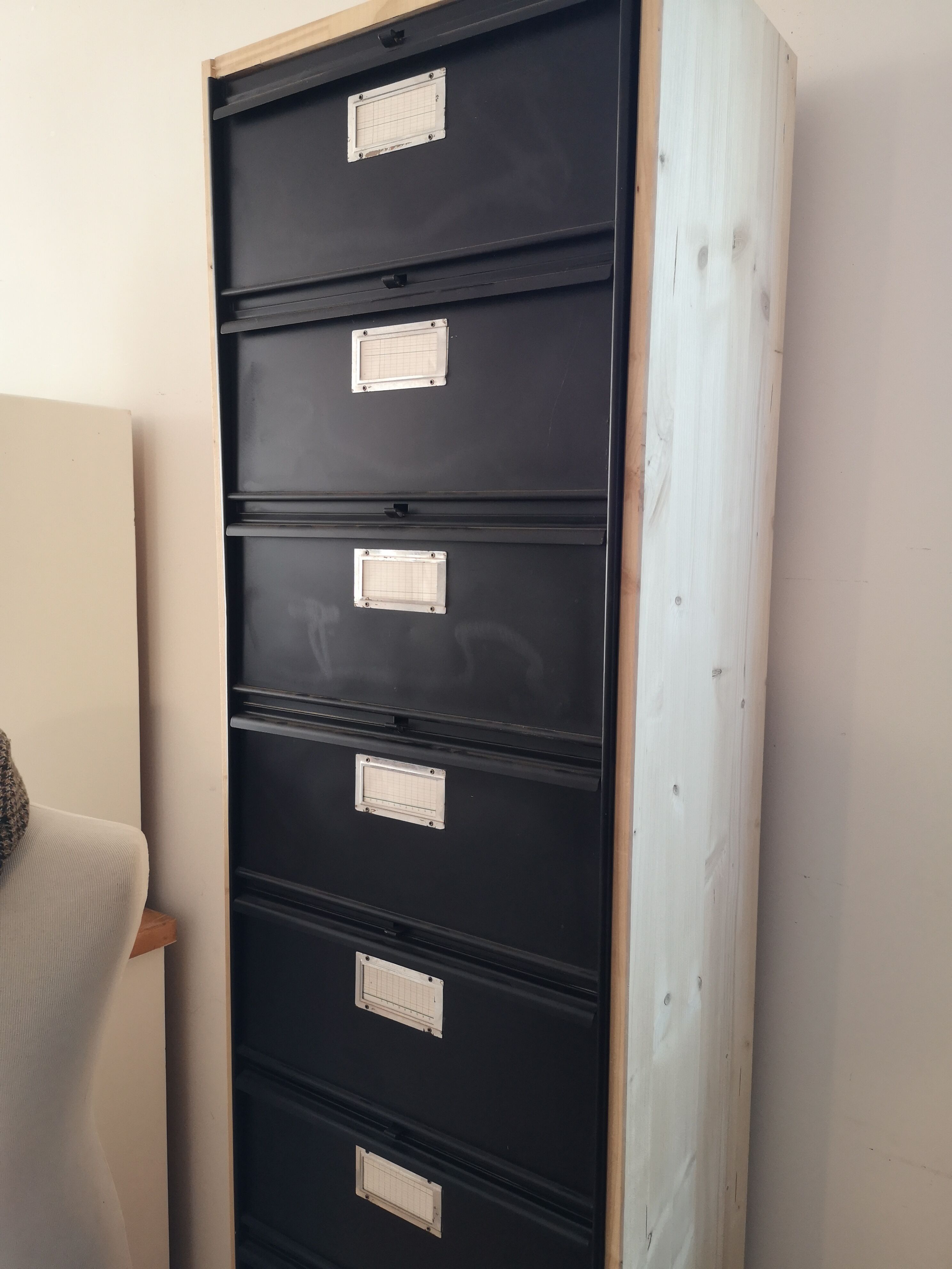 Metal column ten valves storage cabinet administration. Black mast and wood color
