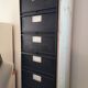 Metal column ten valves storage cabinet administration. Black mast and wood color